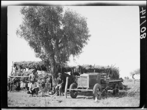 Three expedition members and a Morris Commercial truck outside of the Tanami Police Camp, Central Australia, approximately 1930 / Michael Terry