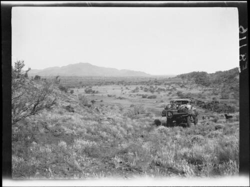 Morris Commercial truck and dog near Jacky Pass with Mount Woodroffe in the distance, Musgrave Ranges, South Australia, 1930 / Michael Terry