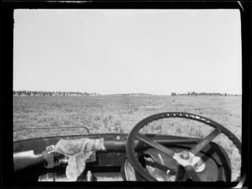 View from the front seat of a Morris Commercial truck on a dry plain, Western Australia?, approximately 1931 / Michael Terry