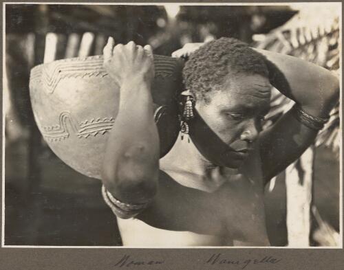 Woman, Wanigella [Wanigela], [carrying a clay bowl on her shoulder] [picture] / Frank Hurley
