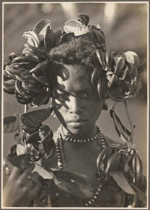 Girls from Village Wanigella [Wanigela], North Coast [girl in elaborate head dress] [picture] / Frank Hurley