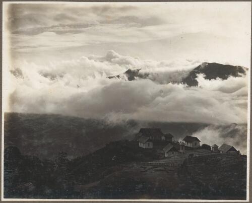 Scenes at Ononge [A village with church in the clouds] [picture] / Frank Hurley