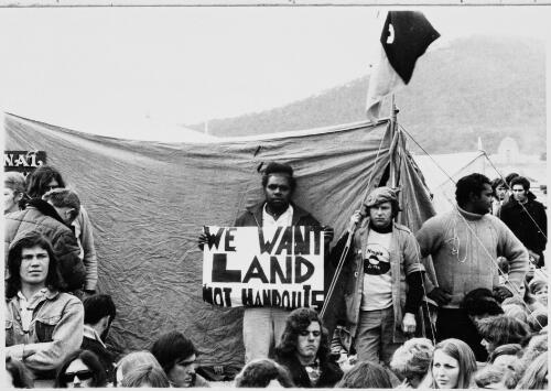 [Demonstration with 'We want land not handouts' placard at land rights demonstration, Parliament House, Canberra, 30 July 1972] [picture] / Ken Middleton