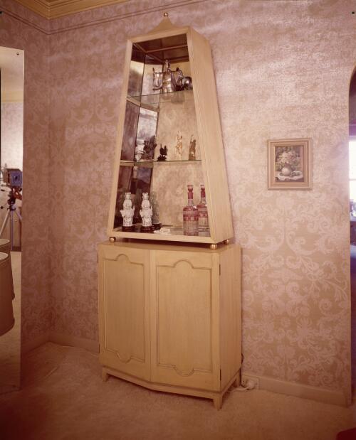 [An obelisk cabinet in a wallpapered room, ca. 1971] [transparency] / David Beal