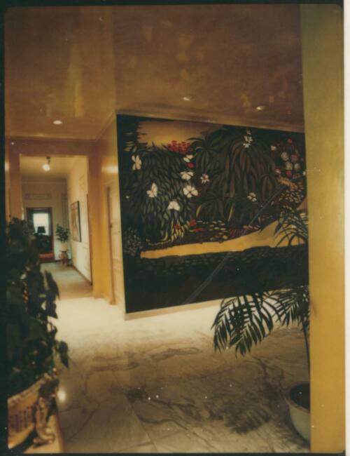 Foyer with shiny gold walls, marble floor and a large jungle mural, ca. 1971 [picture] / David Beal
