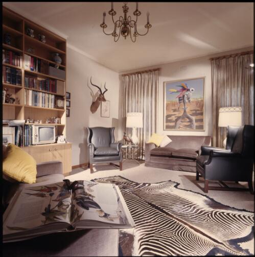 [An Albert Tucker painting hangs above a large zebra pelt and black hide wing chairs, ca. 1971] [transparency] / David Beal