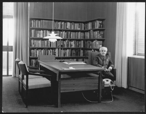 Photographs of Harold White in his office, National Library of Australia, 1968 [picture] / Max Dupain