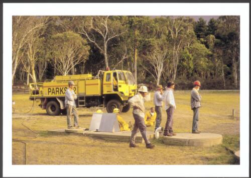 ACT Parks firefighters and staff at Corin Forest Resort take a break from burn-over preparations as they await the arrival of the Stockyard fire, [17 January 2003] [picture] / Jeff Cutting