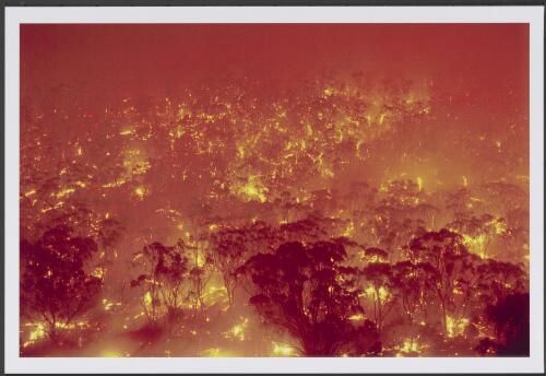 Afterglow of a fiery maelstrom, [with] masses of old timber alight at midnight in the wake of a conflagration on the southern slopes of Mount Tennent, [17 January 2003] [picture] / Jeff Cutting