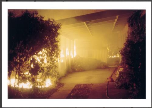 An unattended home in Kambah with the side and back gardens, fences, wood heap and two sheds alight, was abandoned by the owner, [18 January 2003] [picture] / Jeff Cutting