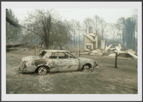 Ruins of a dwelling and motor vehicle, Stromlo Forestry settlement, [19 January 2003] [picture] / Jeff Cutting