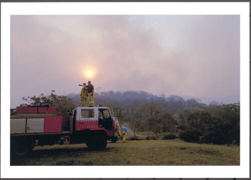 Task force from the Hawkesbury District in NSW on standby for property protection along Smiths Road, as small runs of fire emerge from the Clear Range hills south of Tharwa, [21 January 2003] [picture] / Jeff Cutting
