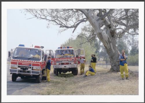 With a forecast of very severe fire weather and free-burning fires in the southern ACT ranges, crews from Queanbeyan City Brigade standby for tasking at Williamsdale Service Station on the Monaro Highway, [30 January 2003] [picture] / Jeff Cutting