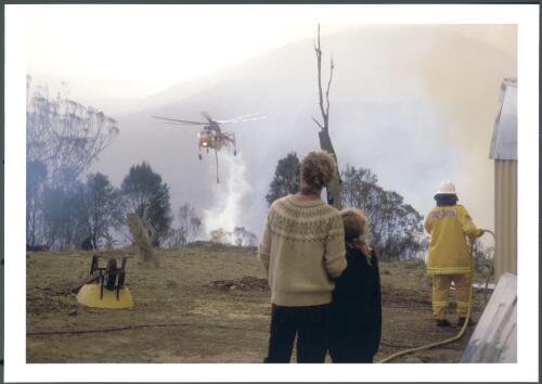 Residents on Clearview Range Michelago, watch with trepidation as an Erickson AIR-CRANE water bombs a run of fire approaching their dwelling, [30 January 2003] [picture] / Jeff Cutting