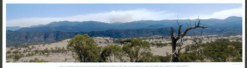 Menace in the mountains, smoke from the Stockyard Spur, Mount Gingera, Bendora, and McIntyre's Hut fires drifting away from Canberra on 13 January 2003 failed to alert the population to the coming conflagration [picture] / by Jeff Cutting
