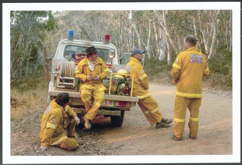 Day crew from Guises Creek Brigade working the southern flank of the Bendora fire waiting on a nightshift changeover on Mount Franklin Road, [13 January 2003] [picture] / Jeff Cutting