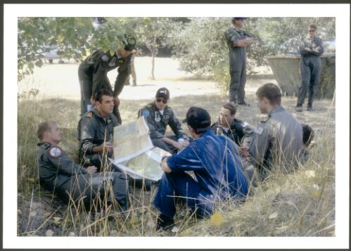 Royal Australian Navy aircrew receiving the daily weather and operations briefing at the forward airbase at Uriarra Forestry settlement, 16th January 2003 [picture] / Jeff Cutting