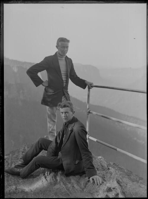 Two males at mountain lookout [picture] / C.C. Fox