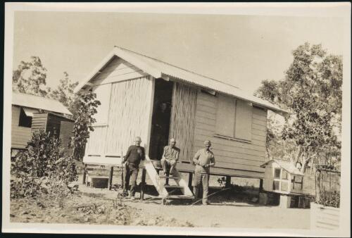 [Three men outside gangers' cottage, Northern Territory railway] [picture]