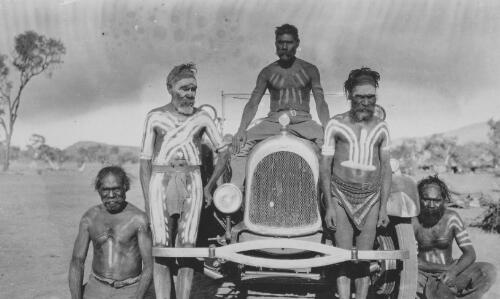 Group of Australian Aboriginal men with car, central Australia, ca. 1920 [picture]