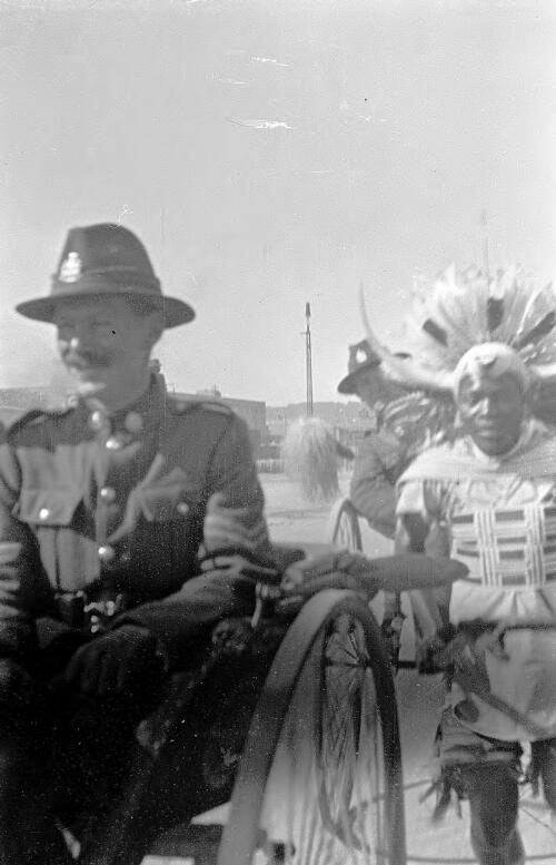 WW1 New Zealand soldiers riding in rickshaws with a African driver wearing colourful dress, Durban, South Africa [picture] / Rex Nan Kivell