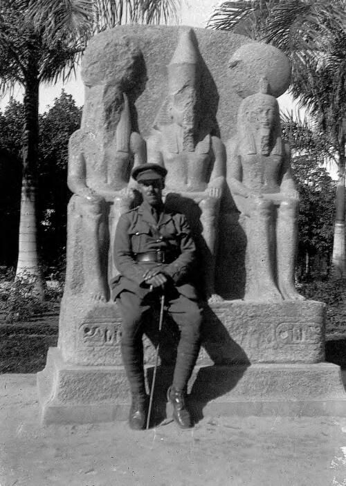 A soldier [probably from New Zealand] in front of Egyptian sculpture [picture] / Rex Nan Kivell