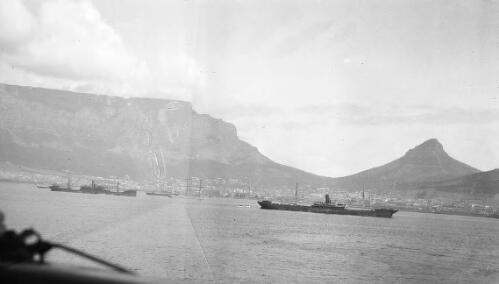 Photo taken from a ship of other WW1 mililtary transport ships in harbour [picture] / Rex Nan Kivell