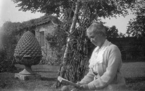 A woman in garden, Morant Manor, Brockenhurst, Hampshire, United Kingdom [picture] / Rex Nan Kivell