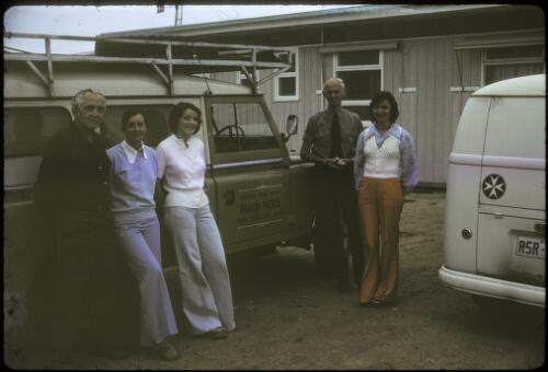 Reverend Andrew Leslie McKay, on left, with his Australian Inland Mission land rover, and three nurses, Andamooka Hospital, South Australia, November 1975 [picture]