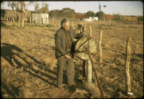 Reverend Les Mckay using a rope-making machine, Queensland, 1972 [picture] / Les McKay