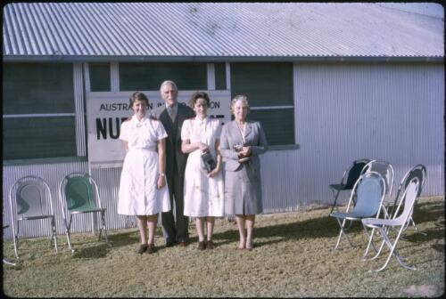 Sir Henry Abel Smith, Governor of Queensland, with Lady Abel Smith and two A.I.M. Nursing Sisters, Birdsville Hospital, Queensland, 1964 [transparency] / Les McKay