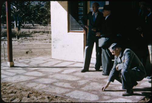 At the Australian Inland Mission Old Timers' homes, Reverend Les McKay in the foreground, Alice Springs, Northern Territory, 1954 [transparency] / Victor Murrell