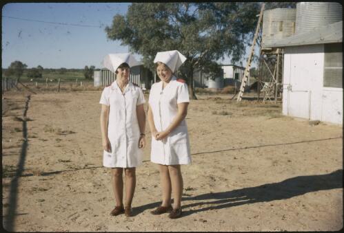Two A.I.M. nurses in uniform, Birdsville, Queensland, ca. 1971 [transparency] / Les McKay