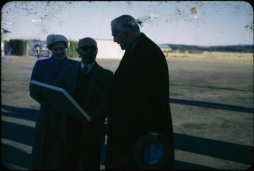 Painting of Flynn's Grave being presented to prime minister Robert Menzies, 1954 [transparency]