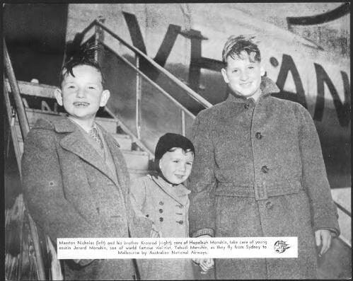 Marston Nicholas (left) and his brother Kronrod (right), sons of Hephzibah Menuhin, take care of young cousin Jerard Menuhin, son of world famous violonist, Yehudin Menuhin, as they fly from Sydney to Melbourne by Australian National Airways [picture]