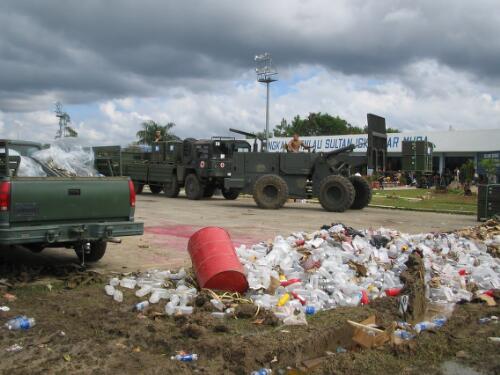 [Ambulance Army trucks and heavy vehicles, Banda Aceh, 11 January 2005] [picture] / AusAID, photographer Robin Davies