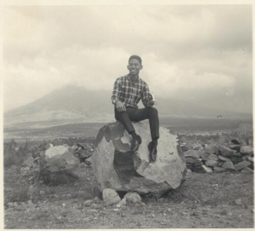 Maurice Biscocho at Cagsawa ruins with Mt. Mayon volcano in background, Philippines, 1967 [picture] / Albert Speer
