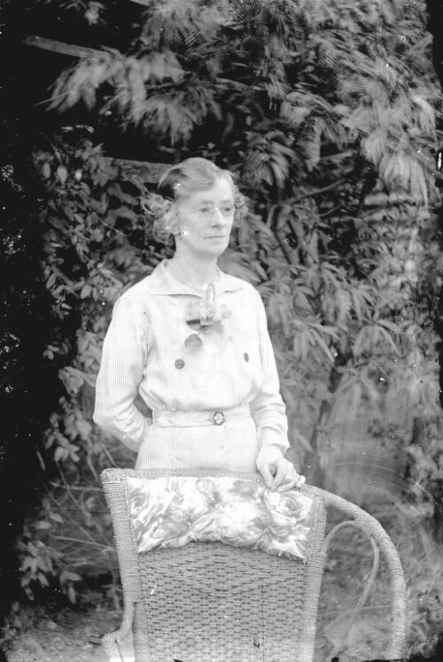 Clara Pullar standing with chair, Clermont, Queensland, ca. 1932 [picture] / Gordon Cumming Pullar