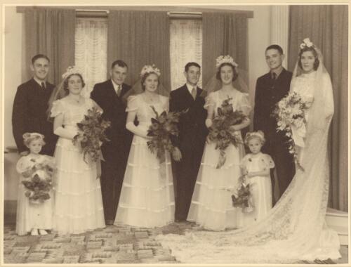 Wedding group consisting of (from left to right) [unidentified man], Mary Shannon, Len Shannon, [unidentified woman], Jack Lockhart, Mary Stewart, Joseph ('Joe') Lockhart and Alice Lockhart (née Shannon) with flower girls Josephine and Margery Lockhart, Swan Hill, Victoria, 12 April 1941 [picture]