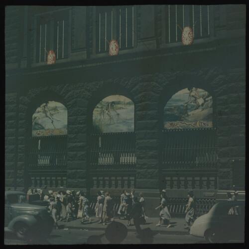 Royal tour decorations, windows painted with aboriginal hunting scenes, ANZ building, Sydney, 1954 [transparency] / Allan Hughes