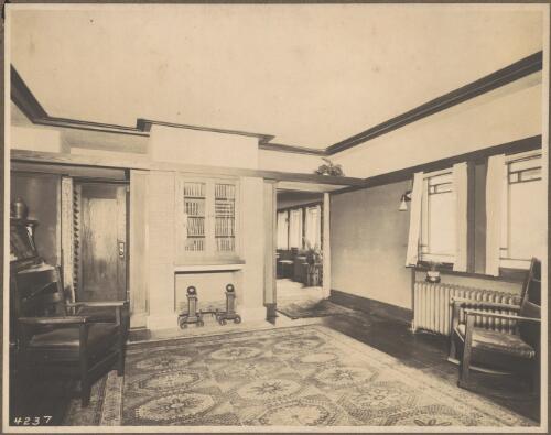 Interior view of a house showing the living room with fireplace [1] [picture]