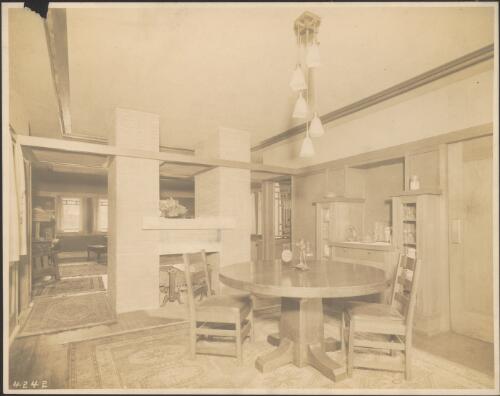 Interior view of fireplace and dining area in Itte paired house, Chicago, Illinois, 1910, [1] [picture]