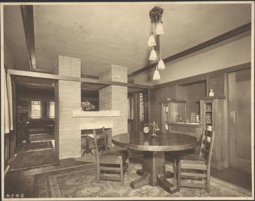 Interior view of fireplace and dining area in Itte paired house, Chicago, Illinois, 1910, [2] [picture]