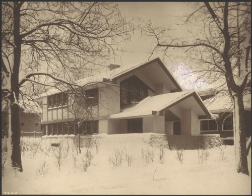 Oblique exterior view of Comstock house in snow, Evanston, Illinois, [1] [picture] / Walter Burley Griffin