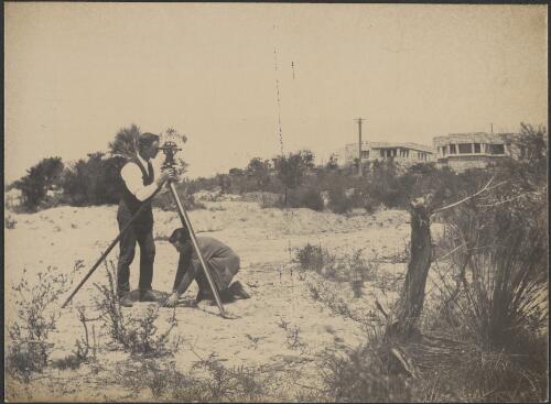 Exterior views of Castlecrag houses and surveyor with theodolite in foreground, [1] [picture] / [Walter Burley Griffin]