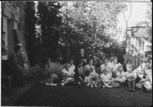 Walter Burley Griffin and Marion Mahony Griffin, with a group of people in backyard, Castlecrag, Sydney, New South Wales [transparency]