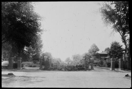 Entry gate to Millikin Place, Decatur, Illinois, ca. 1910 [transparency]