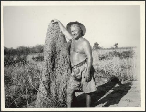 [Bill Harney beside a termite mound, ca. 1950s] [picture]