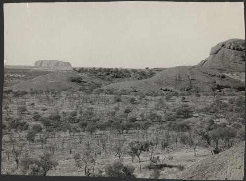 [View of Uluru (Ayres Rock) and surrounding country, Uluru, Northern Territory, ca. 1950s] [picture] / Keith P. Phillips