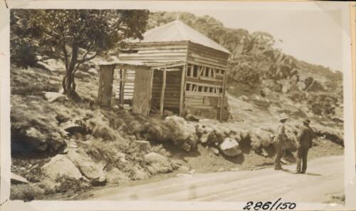 The old "Red Hut" with damaged walls [picture] / Department of Main Roads